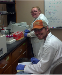 REU student Scott Hamby (bottom) running nutrient analyses on a spectrophotometer